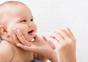 Pediatric Dentistry. Ottawa Dentist examining little baby`s mouth.